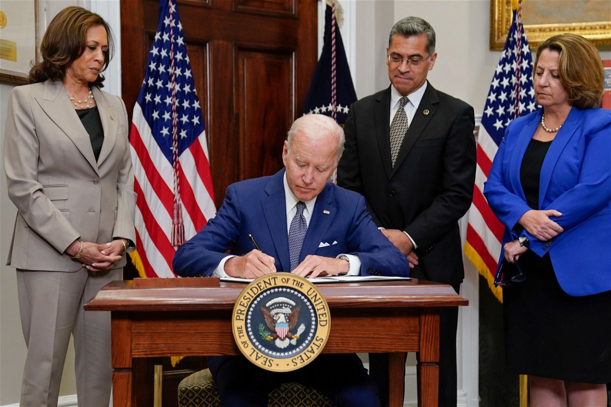 <i>Evan Vucci/AP</i><br/>President Joe Biden signs an executive order on abortion access during an event in the Roosevelt Room of the White House