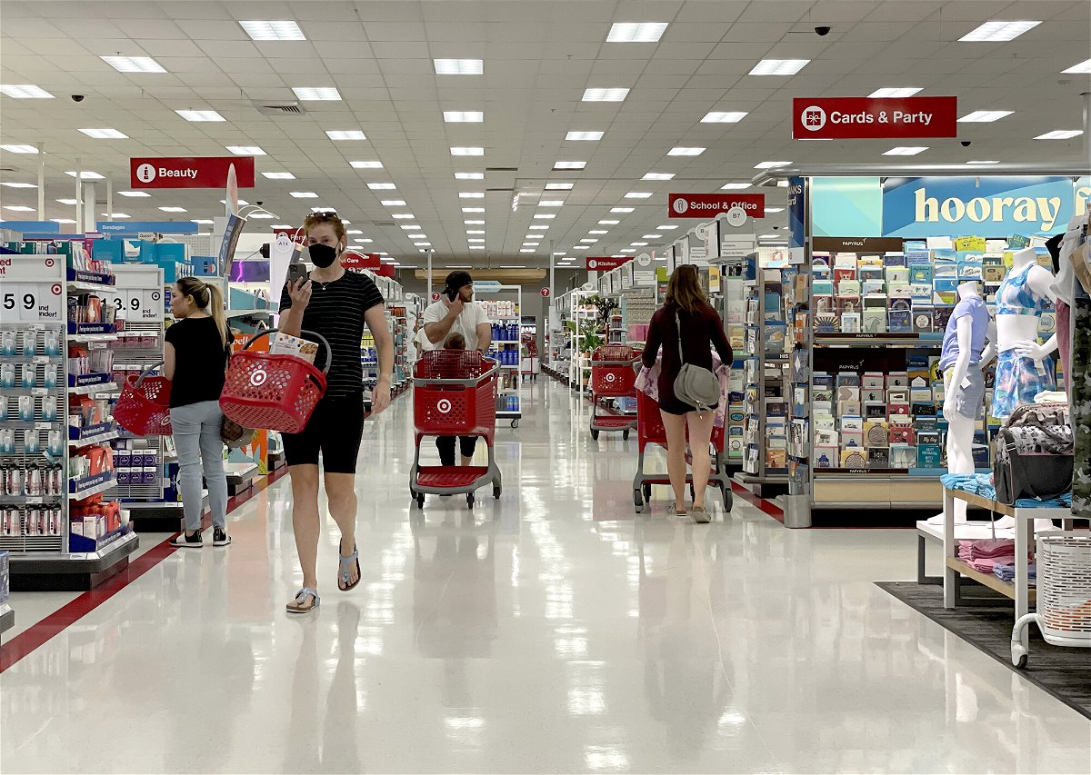 <i>Justin Sullivan/Getty Images</i><br/>Most major grocery stores and retailers are open and pictured customers shop at a Target store on June 8
