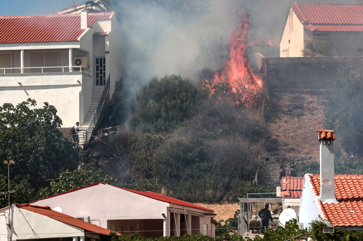 <i>MANOLIS LAGOUTARIS/AFP/Getty Images</i><br/>Hundreds of residents and tourists have been evacuated on the Greek island of Lesbos after a wildfire broke out