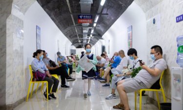 China endures a summer of extreme weather as record rainfall and scorching heat wave cause havoc. Residents are pictured here in an air-raid shelter to escape summer heat amid a heat wave warning in Nanjing