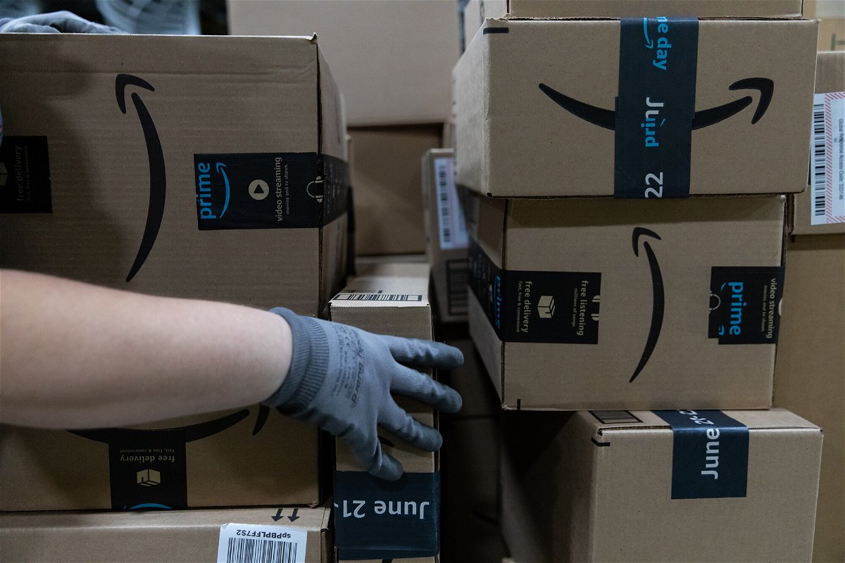 <i>Rachel Jessen/Bloomberg/Getty Images</i><br/>A worker loads boxes onto a pallet at an Amazon fulfillment center on Prime Day in Raleigh