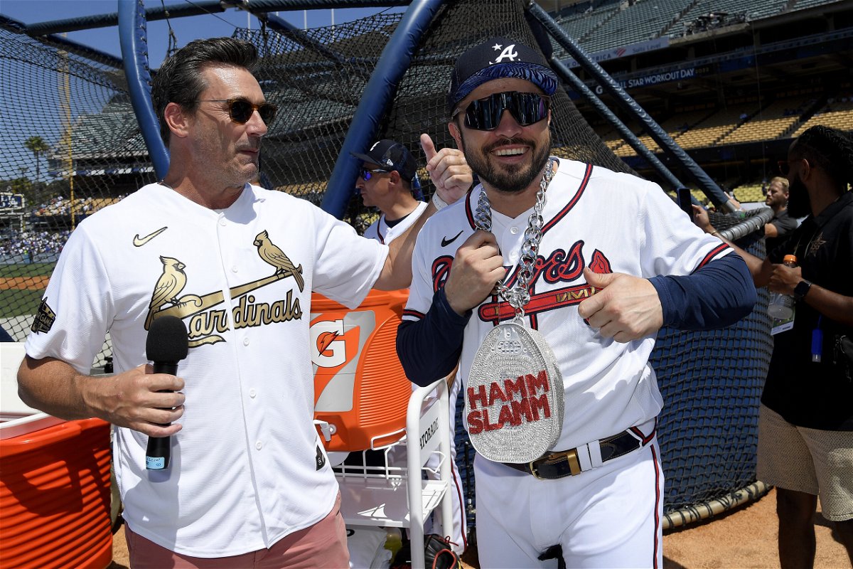 <i>Kevork Djansezian/Getty Images</i><br/>Jon Hamm talks with Travis d'Arnaud of the Atlanta Braves during the 2022 Gatorade All-Star Workout Day at Dodger Stadium on July 18 in Los Angeles.
