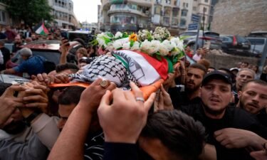 US says Israeli military gunfire is likely responsible for Shireen Abu Akleh's death but examination of the bullet is inconclusive. Palestinian mourners carry the body of Abu Akleh in the West Bank city of Ramallah