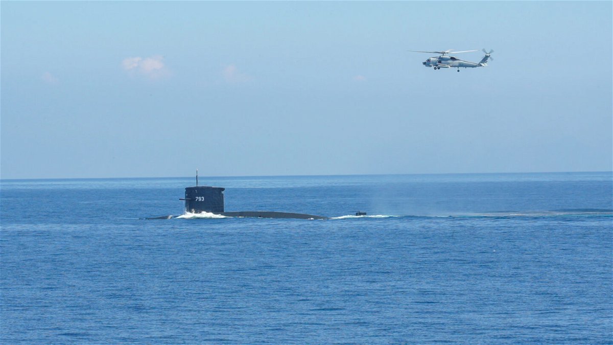 <i>Walid Berrazeg/CNN</i><br/>A helicopter and a submarine take part in Taiwan's live-fire military drills on July 26.