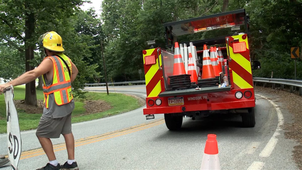 <i>WGAL</i><br/>A worker monitors a road closure near the scene of the accident.