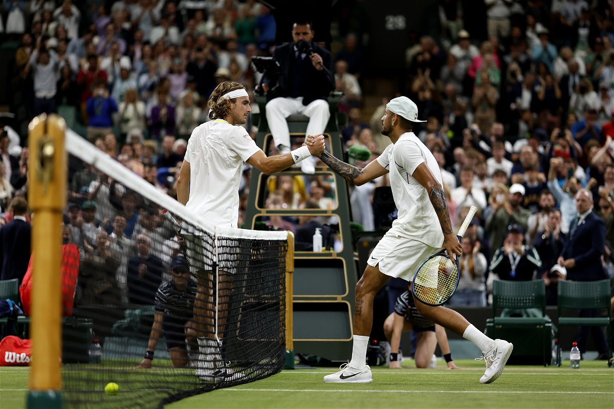<i>Steven Paston/PA Images/Getty Images</i><br/>Tsitsipas (left) and Kyrgios shake hands after their Wimbledon third-round match.