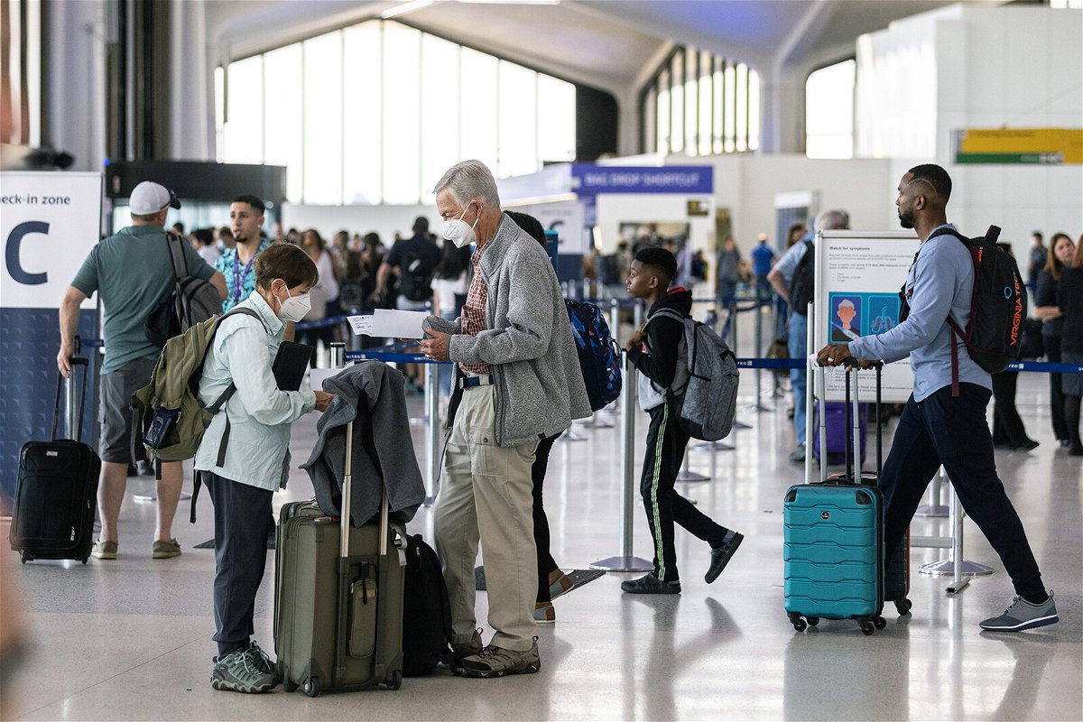 <i>Jeenah Moon/Getty Images</i><br/>Travelers line up to check in at Newark Liberty International Airport on July 1. Newark is the world's No. 2 airport for cancellations this summer.