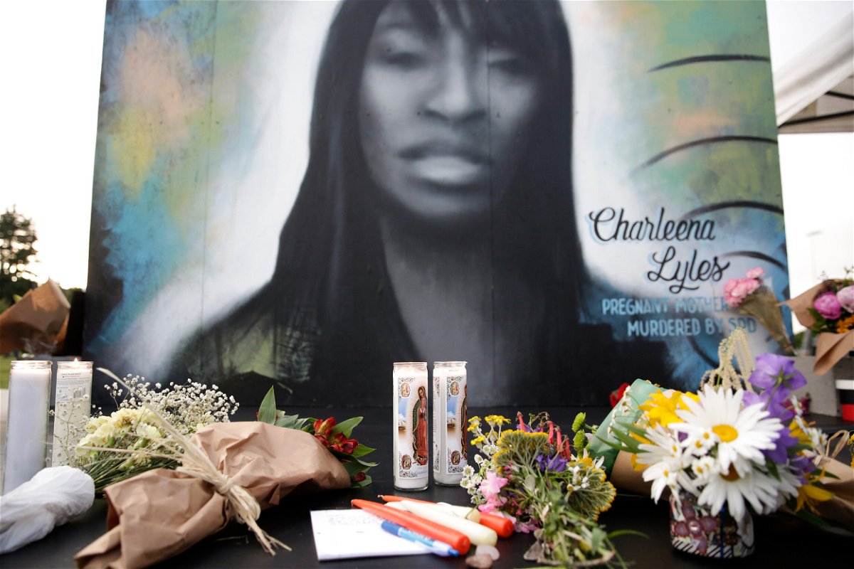 <i>Jason RedmondAFP/Getty Images</i><br/>Flowers and candles are pictured at a makeshift memorial during a vigil on the third anniversary of the death of Charleena Lyles who was shot and killed by Seattle police.