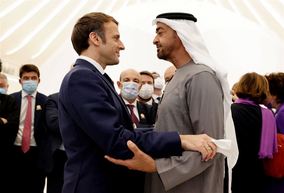 <i>Thomas Samson/AFP/Getty Images</i><br/>French President Emmanuel Macron (L) is greeted by Abu Dhabi's Crown Prince Mohammed bin Zayed al-Nahyan during his tour of the Emirates pavillion at the Dubai Expo on the first day of his Gulf tour on December 3