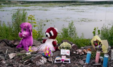 A memorial for the three children is seen on the edge of Vadnais Lake on the 4th of July.