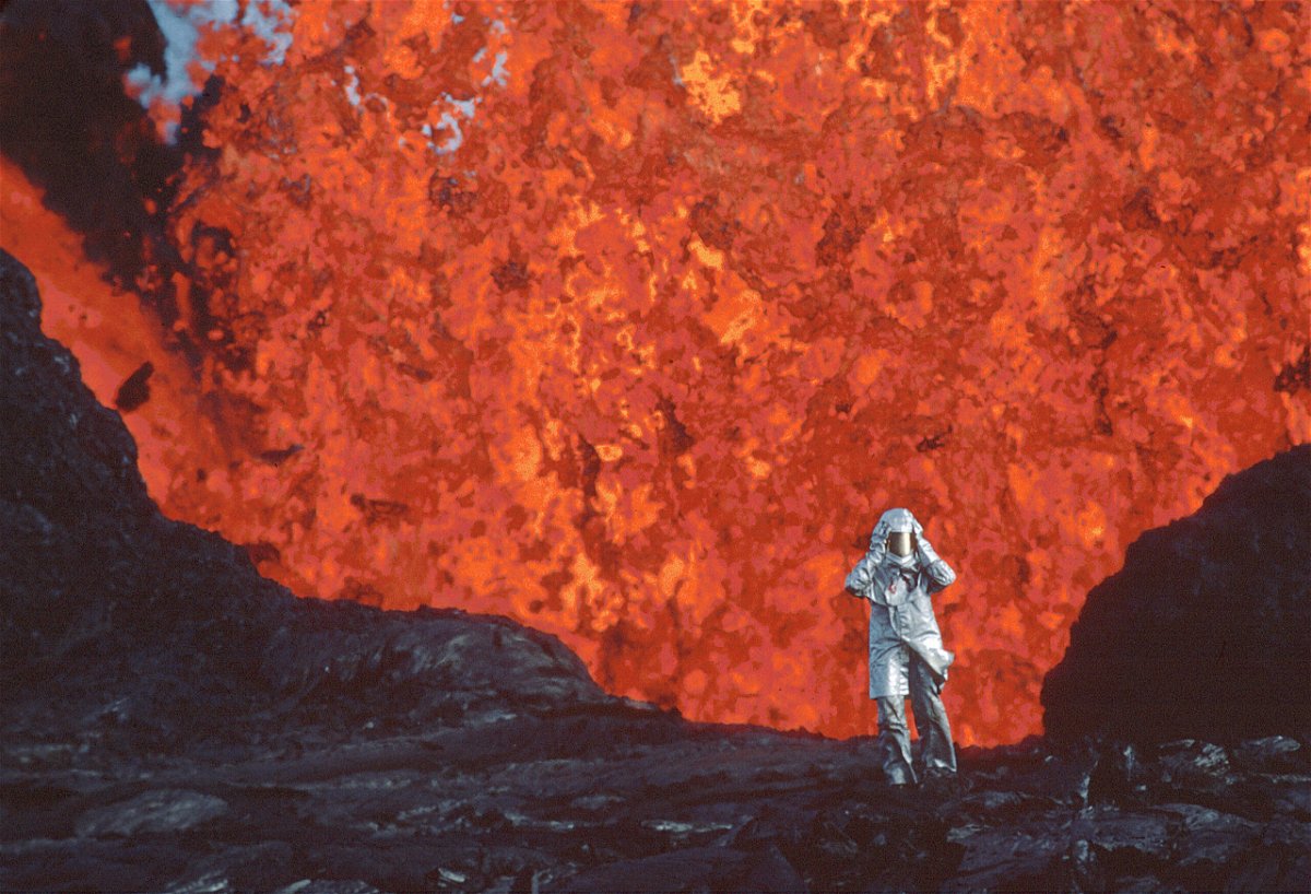 <i>Image'Est</i><br/>Katia Krafft wearing aluminized suit standing near lava burst at Krafla Volcano