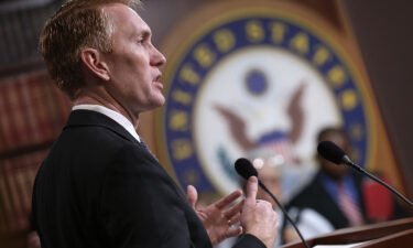 Sen. James Lankford (R-OK) answers questions during a press conference at the U.S. Capitol on wasteful spending by the federal government November 30