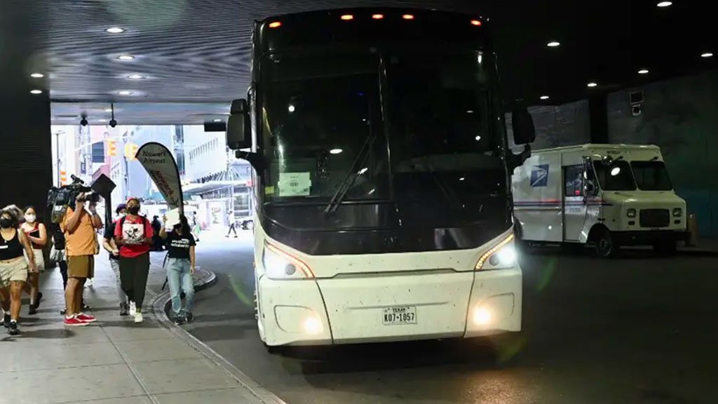 A bus carrying migrants from Texas arrives in New York City on Sunday, the second such bus to arrive in the city since Gov. Greg Abbott announced that New York would join Washington, D.C., as a destination for migrants being bused from the border.