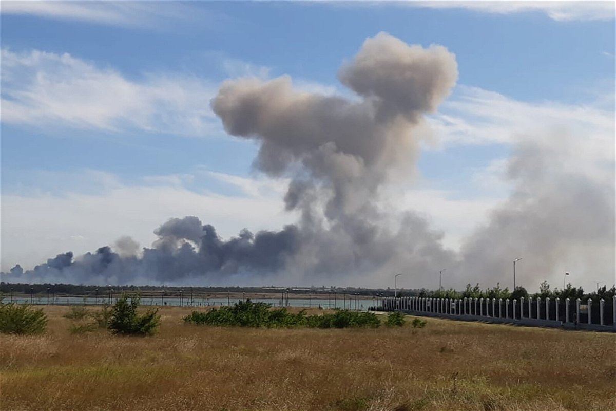 <i>Reuters</i><br/>Smoke rises after explosions were heard from the direction of a Russian military base in Crimea on August 9.