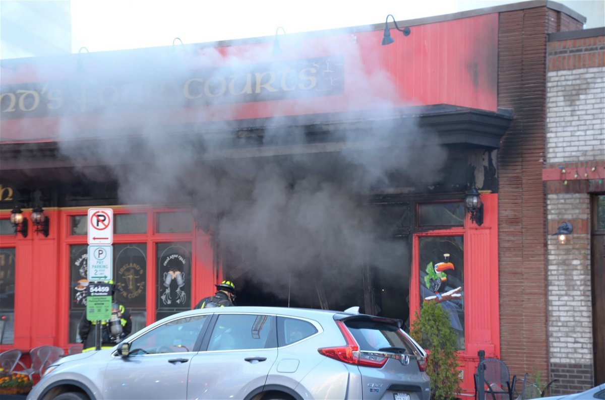 <i>Courtesy Xavier Halloun</i><br/>Firefighters at Ireland's Four Courts pub and restaurant in Arlington