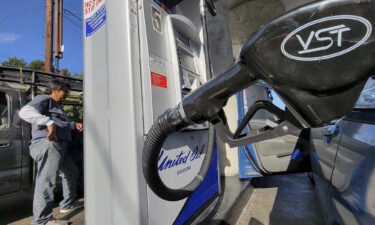 The national average for a gallon of regular gas has dropped every single day since soaring to a record high of $5.02 a gallon on June 14. A motorist pumps gas at United Oil in Los Angeles on August 12.