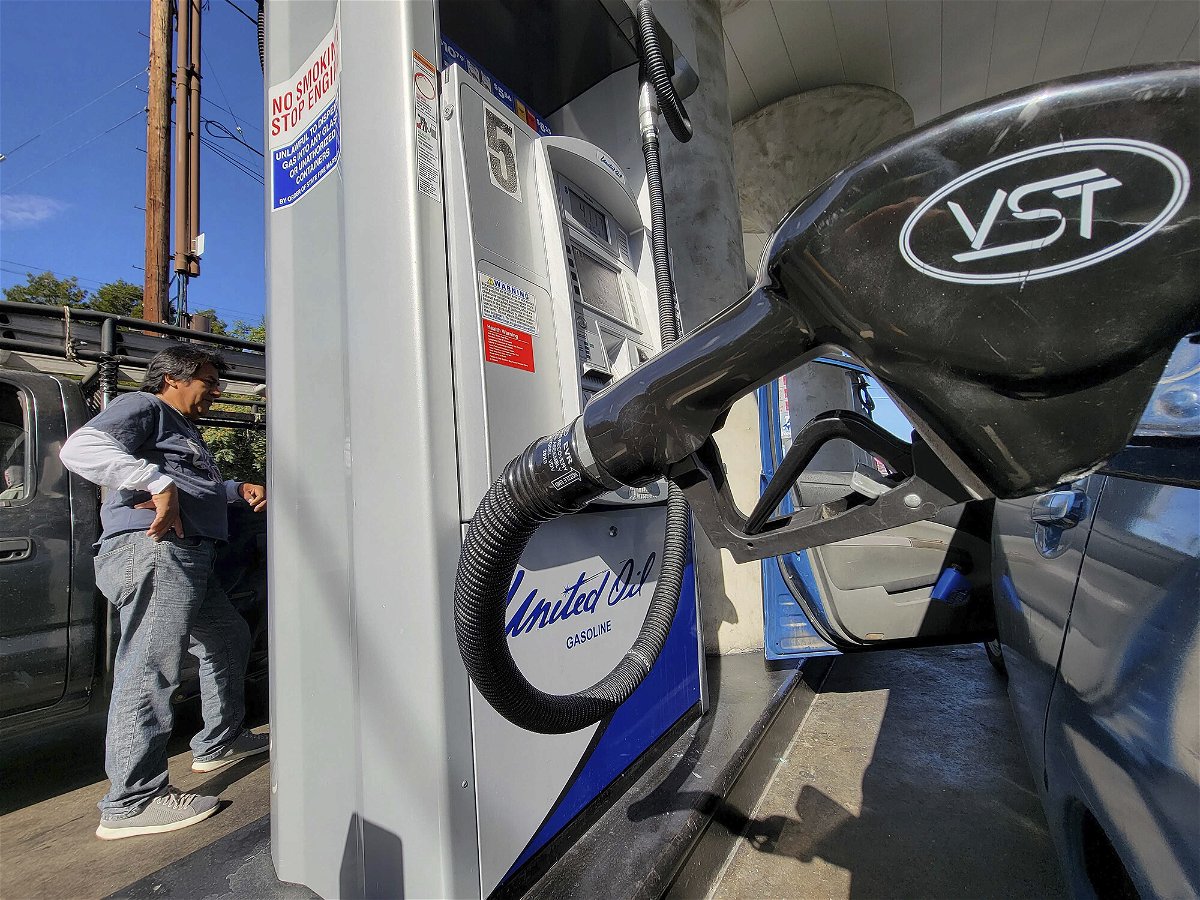 <i>Damian Dovarganes/AP</i><br/>The national average for a gallon of regular gas has dropped every single day since soaring to a record high of $5.02 a gallon on June 14. A motorist pumps gas at United Oil in Los Angeles on August 12.