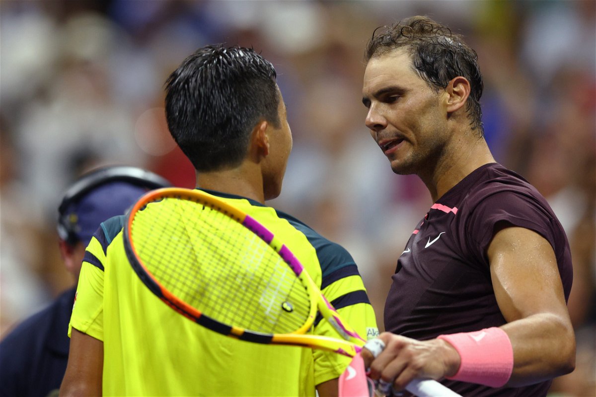<i>Elsa/Getty Images North America/Getty Images</i><br/>Rafael Nadal (right) and Rinky Hijikata meet at the net following their first-round match.