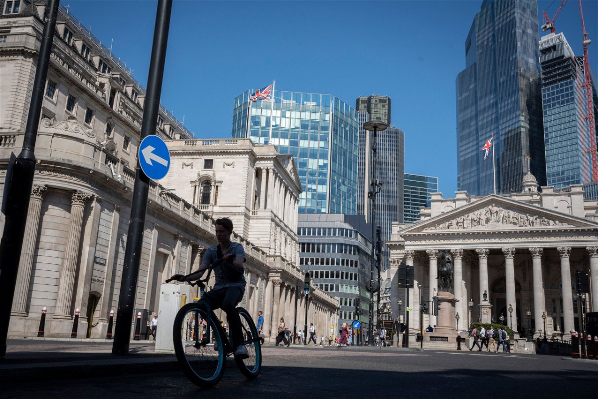<i>Richard Baker/In Pictures/Getty Images</i><br/>UK workers have suffered the biggest drop in their spending power in more than 20 years as prices keep soaring. A cyclist rides past in London on August 11.
