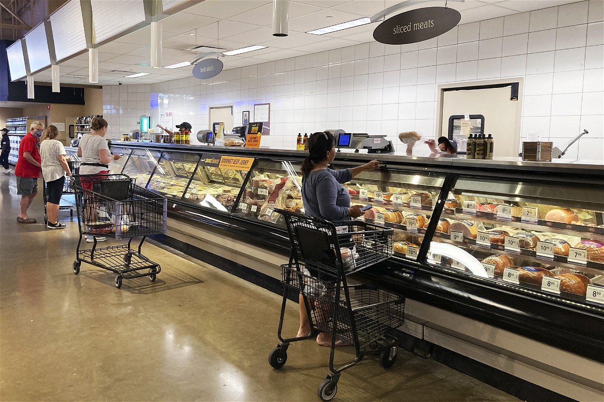 <i>Nam Y. Huh/AP</i><br/>Shoppers shop at a grocery store in Glenview