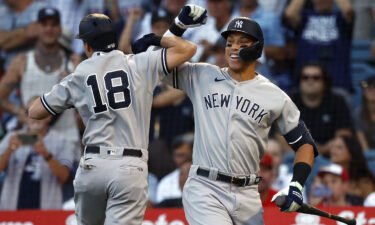 Aaron Judge (right) hit his 51st home run of the season against the Angels.