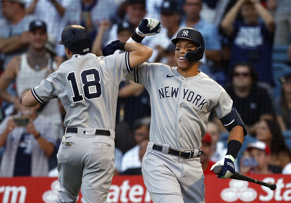 <i>Ronald Martinez/Getty Images North America/Getty Images</i><br/>Aaron Judge (right) hit his 51st home run of the season against the Angels.