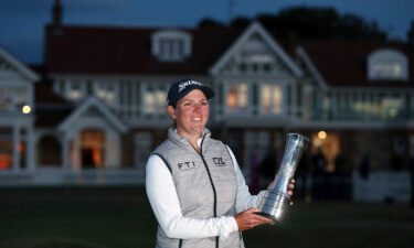 South Africa's Ashleigh Buhai poses with the trophy after winning the Women's British Open in Muirfield