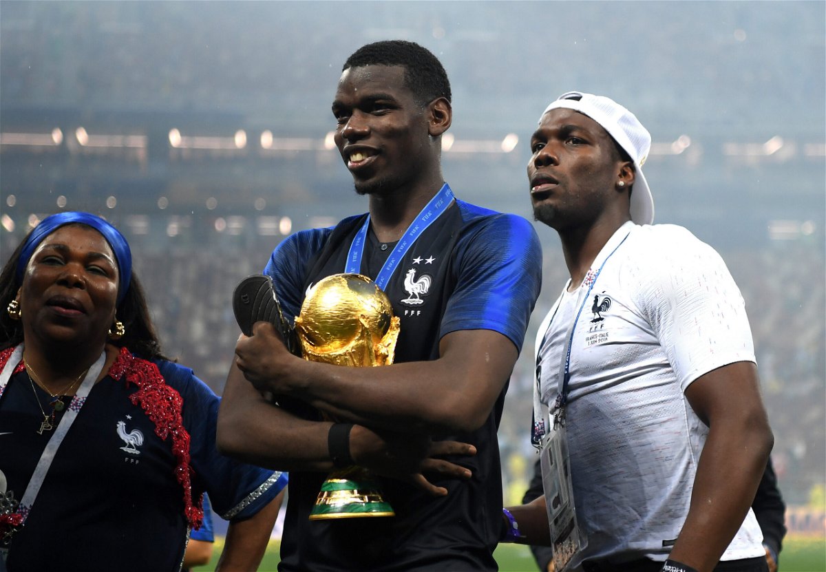 <i>Shaun Botterill/Getty Images</i><br/>Paul Pogba (c) celebrates victory with mother Yeo and brother Mathias during the 2018 FIFA World Cup final.