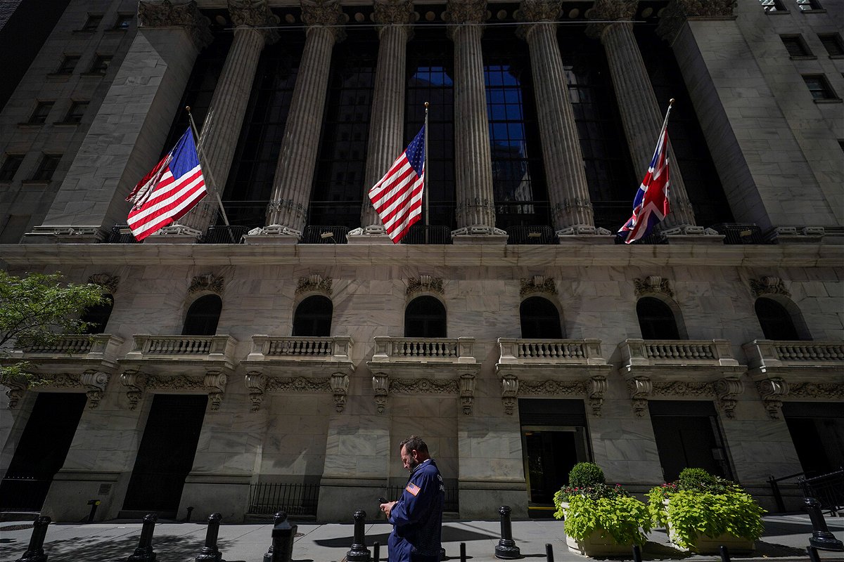 <i>Mary Altaffer/AP</i><br/>US stocks opened lower on September 19 after all three major indexes logged their worst week since June. A trader looks over his cell phone outside the NYSE on September 14 in Manhattan.
