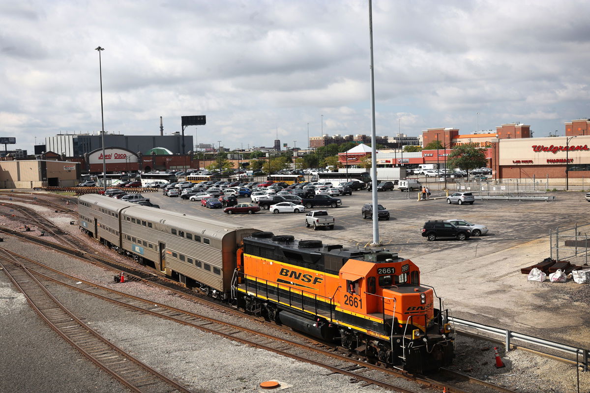 <i>Scott Olson/Getty Images</i><br/>A BNSF engine pull Metra commuter train cars at the Metra/BNSF railroad yard outside of downtown on September 13 in Chicago