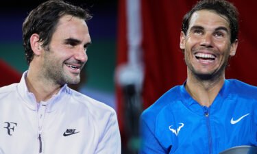 Federer (left) and Nadal laugh together following a match in Shanghai in 2017.
