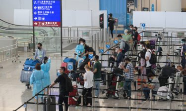 The Hong Kong government announced the ending of formal quarantine for international travelers after more than two and a half years of stringent pandemic controls. Travelers are seen at the Hong Kong International Airport in August 2022.