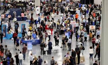 The Fed's latest economic projections show that the central bank is expecting the nation's unemployment rate to grow to 4.4% next year. Job seekers visit booths during the Spring Job Fair at the Las Vegas Convention Center on April 15.