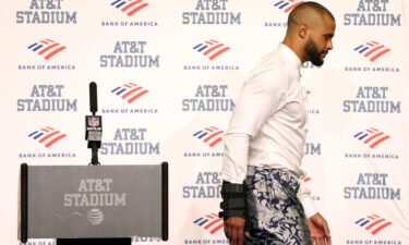 Prescott walks away from the podium during the post-game press conference after losing against the Bucs on September 11.