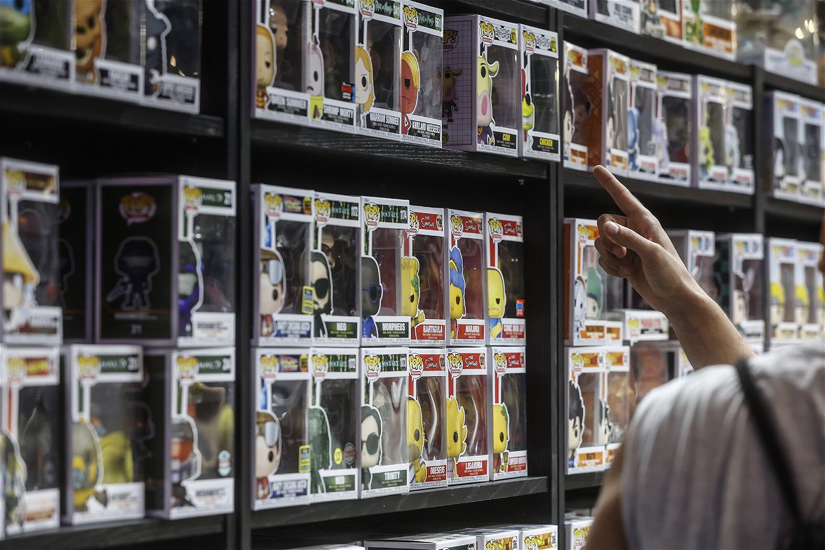 <i>Rober Solsona/Europa Press/Getty Images</i><br/>Toy companies expect grown-ups to shop more for other adults this holiday season. A man is seen here pointing to a shelf of 'Funko Pop' items on July 1