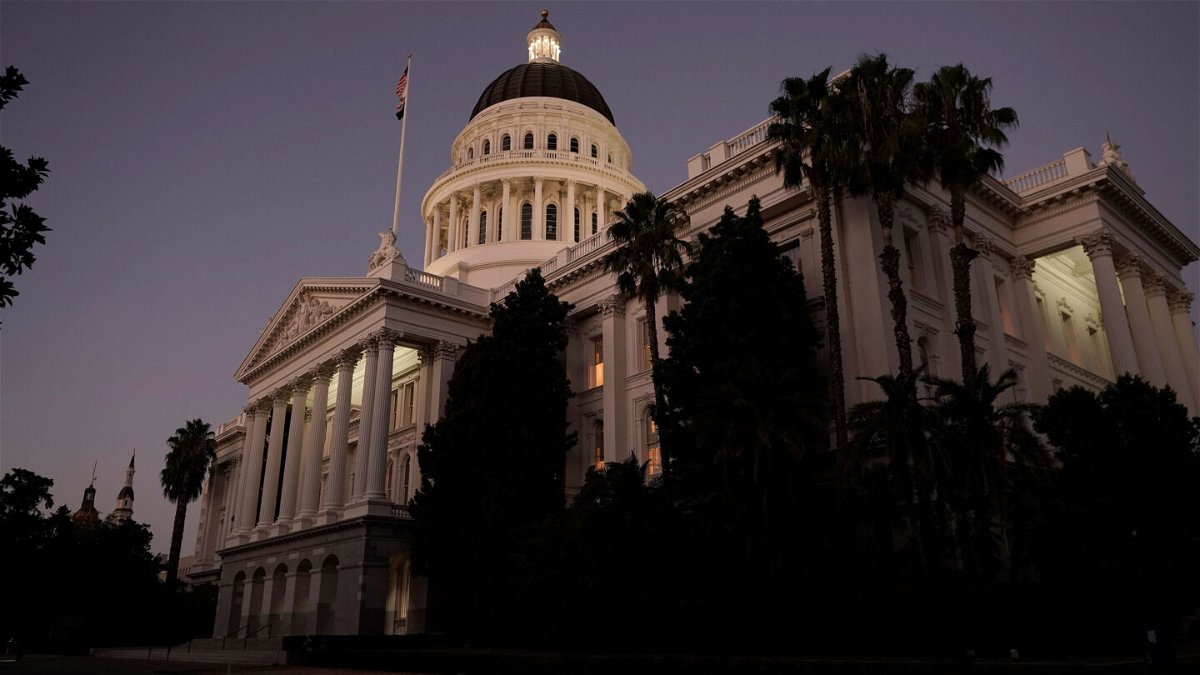 <i>Rich Pedroncelli/AP</i><br/>The lights of the California state Capitol glow into the night in Sacramento on August 31. California passed a 'historic' legislative package protecting or expanding abortion access.
