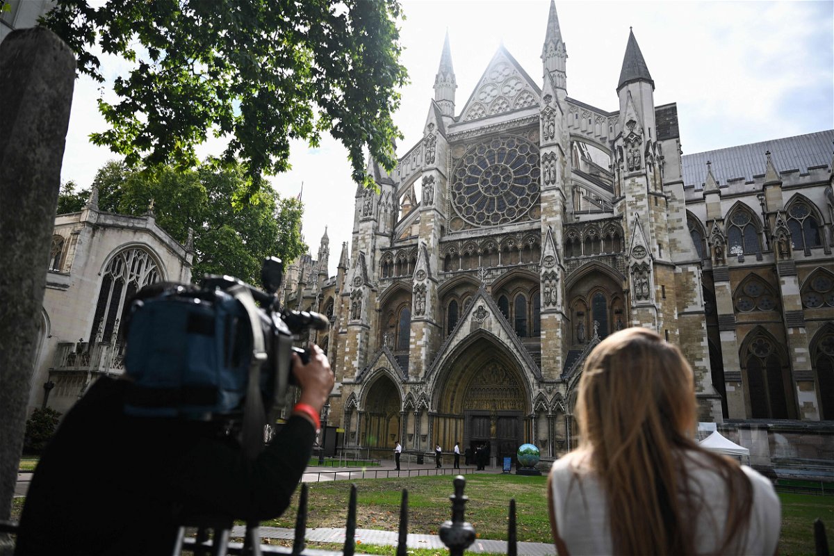 <i>Marco Bertorello/AFP/Getty Images</i><br/>A camera operator films the Westminster Abbey