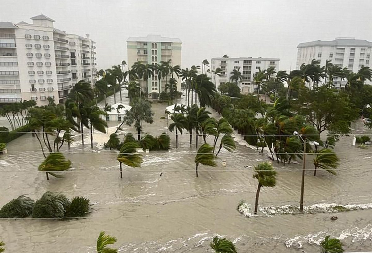 Search and rescue teams are working before dawn to respond to hours-old calls for help that came as Ian slammed the state's west coast as a Category 4 hurricane. A flooded Gulfshore Boulevard in Naples Florida on September 28
