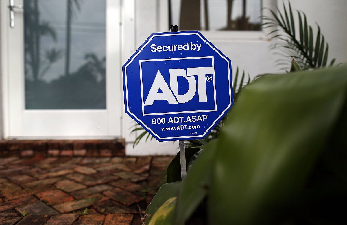 <i>Joe Raedle/Getty Images</i><br/>State Farm is making a $1.2 billion investment in ADT. An ADT home security alarm sign is seen in front of a Miami home in 2016.