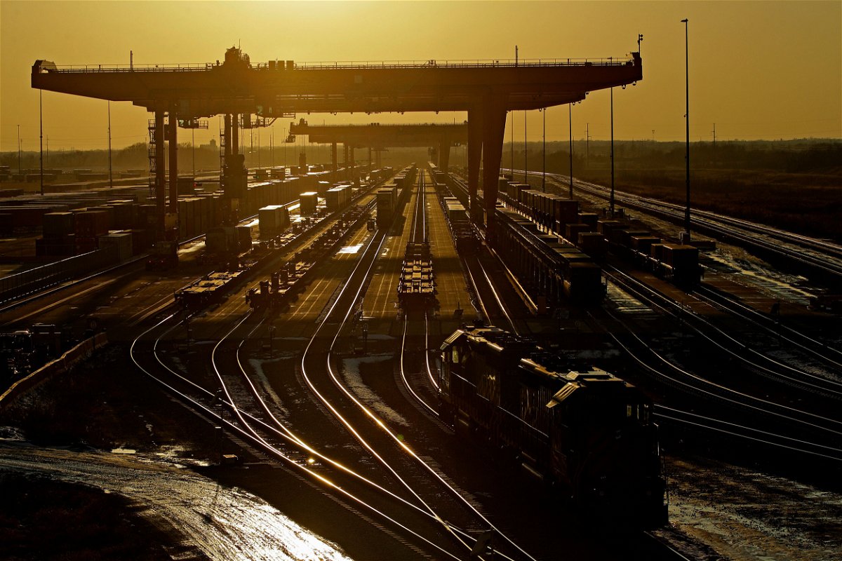 <i>Charlie Riedel/AP/File</i><br/>The US economy can keep running without freight trains — but not for long. Shipping containers are pictured here at a BNSF Railway intermodal facility as the sun sets in Edgerton