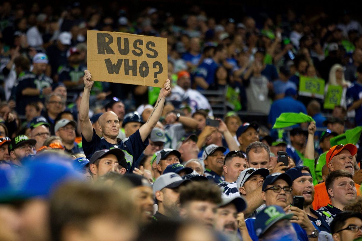 <i>Lindsey Wasson/AP</i><br/>A Seattle Seahawks fan holds a sign referencing Russell Wilson during the second half.