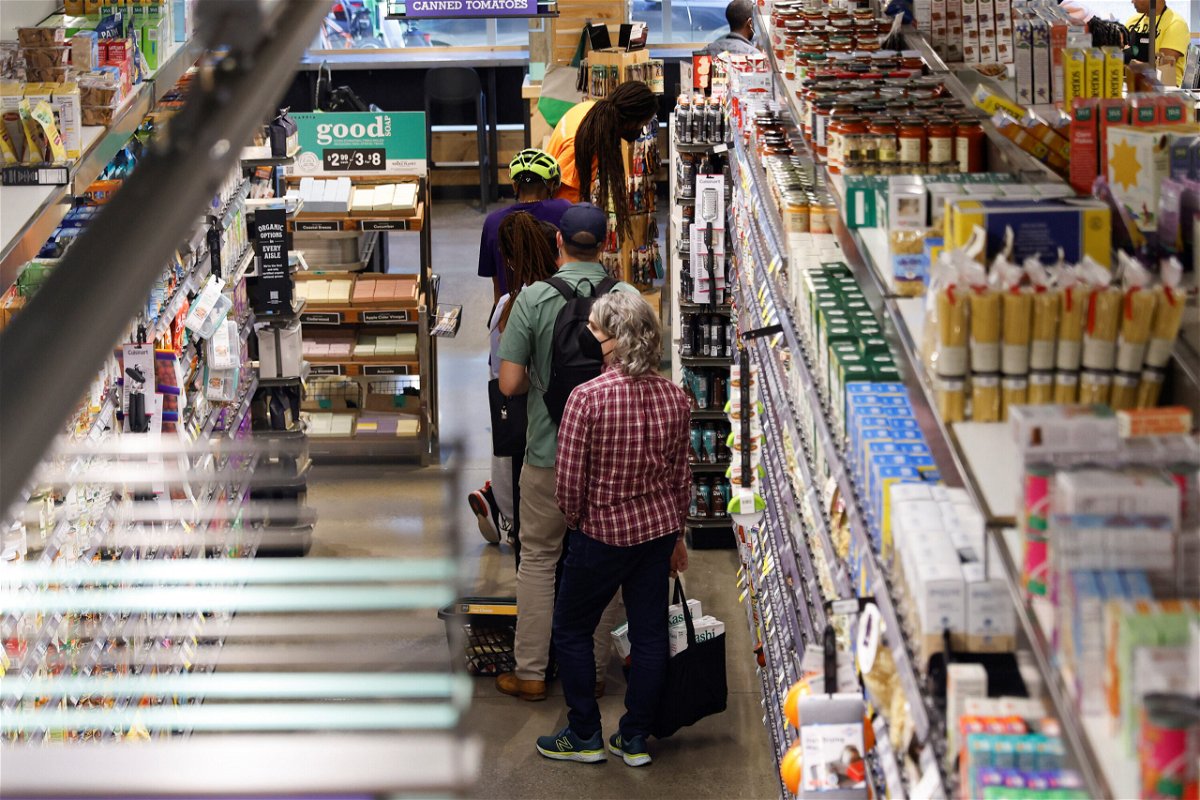 <i>Ting Shen/Xinhua/Getty Images</i><br/>People shop at a local supermarket in Washington