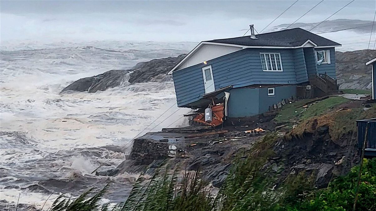 <i>Rene Roy/Wreckhouse Press/AP</i><br/>A home fights against high winds caused by post Tropical Storm Fiona in Port aux Basques