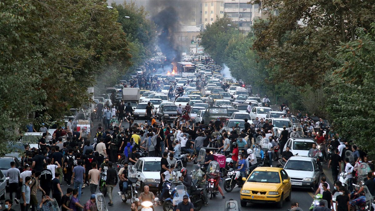 <i>AP</i><br/>Protesters chant slogans during a protest in downtown Tehran