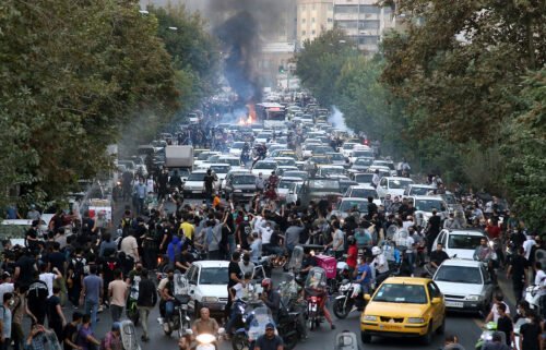 Protesters chant slogans during a protest in downtown Tehran