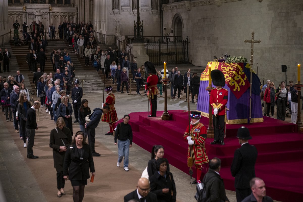 <i>Lauren Said-Moorhouse/CNN</i><br/>Members of the public view the coffin of Queen Elizabeth II as it lies in state in London's Westminster Hall on Thursday