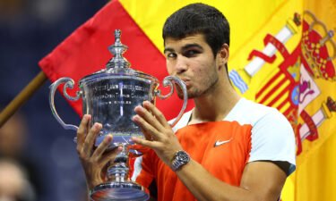 Carlos Alcaraz celebrates with the championship trophy after defeating Casper Ruud in the 2022 US Open at Billie Jean King National Tennis Center on September 11