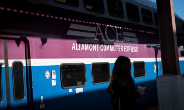 US commuter rail service will face a huge disruption September 16 if a freight rail strike is not avoided. A commuter is pictured here standing near a San Joaquin Altamont Commuter Express train in San Jose