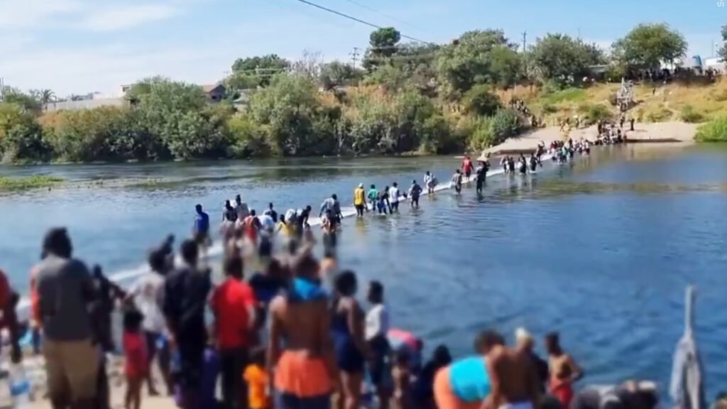 Migrants crossing the river in Del Rio
