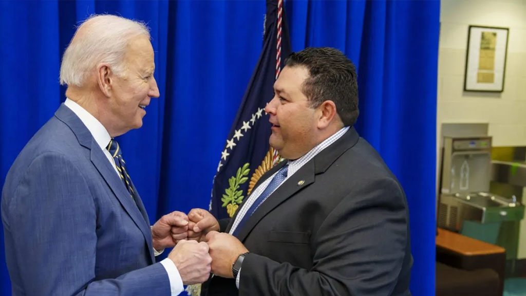 El Paso's Noel Candelaria, right, greets President Joe Biden at Luis Muñoz-Marín Elementary School in Philadelphia on March 11.